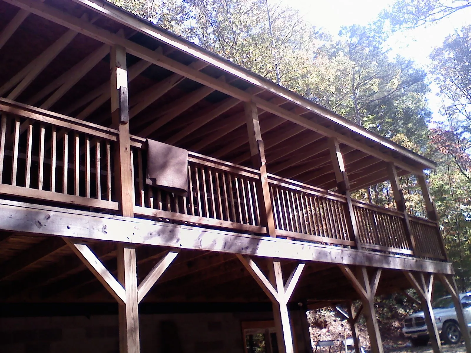 Timber framing under a new elevated porch and deck — Roof Leak Repair in Means by Roofing Brothers